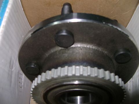 1998 Ford Crown Victoria - Close-up of a vehicle wheel hub assembly, likely for ABS, with its gear-like ring visible.