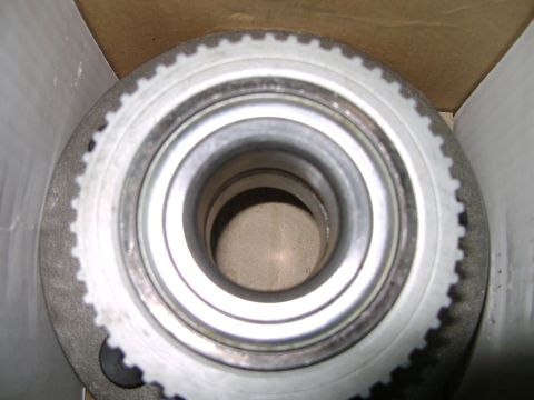 1998 Ford Crown Victoria - This is a close-up view of a vehicle's wheel hub assembly, showing its internal components and a toothed ring around the outer edge.
