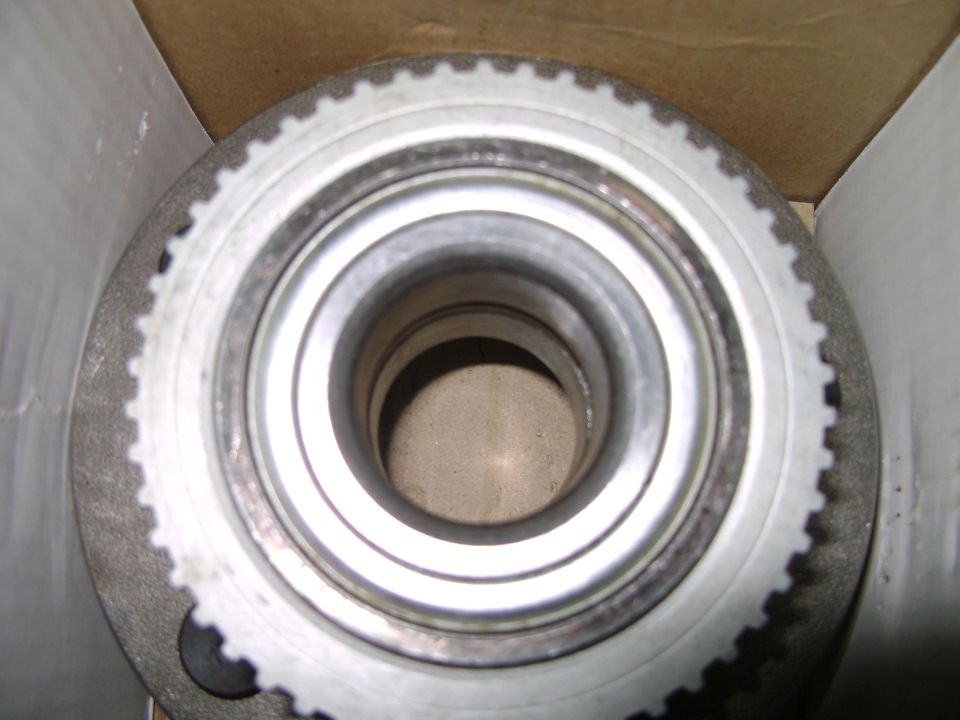 Close-up of a vehicle wheel hub assembly with a toothed ring