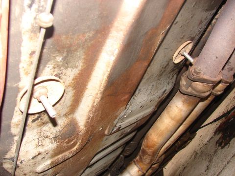 1973 Ford Ranchero - Close-up of the undercarriage, focusing on the exhaust system and frame structure.
