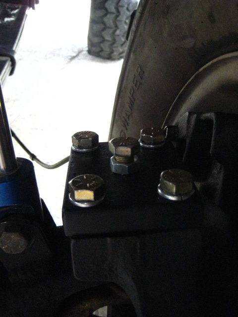 1989 Ford Bronco - Bolted suspension component, likely part of an off-road vehicle's axle or steering system.