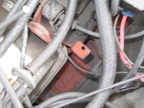 1991 Ford LTD Crown Victoria - Close-up view of a cluttered engine compartment, showing various hoses and wiring.