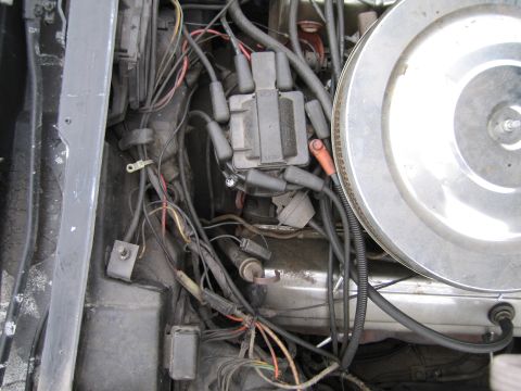 1991 Ford LTD Crown Victoria - Close-up view of a vehicle's engine compartment, showing various components and wiring.