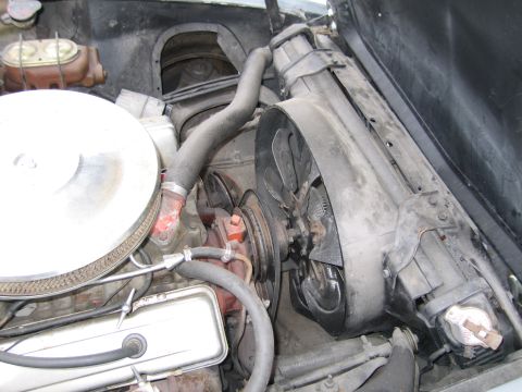 1991 Ford LTD Crown Victoria - Close-up view of the engine compartment, showing the radiator and fan assembly.