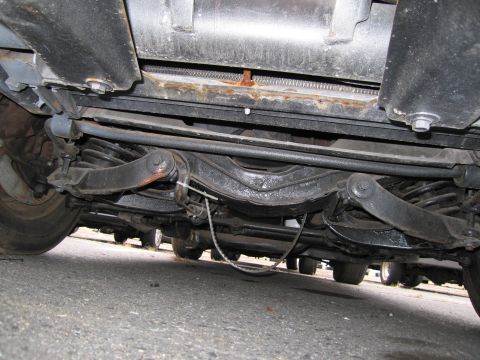 1991 Ford LTD Crown Victoria - Undercarriage view of a vehicle, with other vehicles parked nearby.