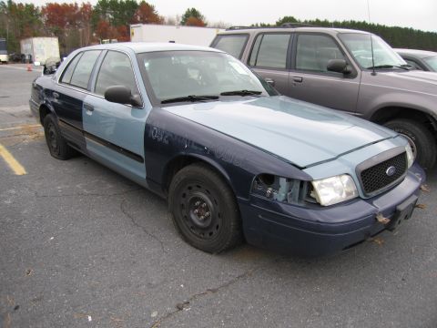 1991 Ford LTD Crown Victoria - This 1991 Ford Crown Victoria LTD police car shows damage to its front end and a two-tone paint scheme.