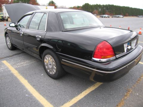 1991 Ford LTD Crown Victoria - This 1991 Ford Crown Victoria LTD is seen from a 3q-front angle with its hood open.