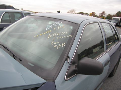 1991 Ford LTD Crown Victoria - This 1991 Ford Crown Victoria LTD has a two-tone paint job and writing on the windshield.