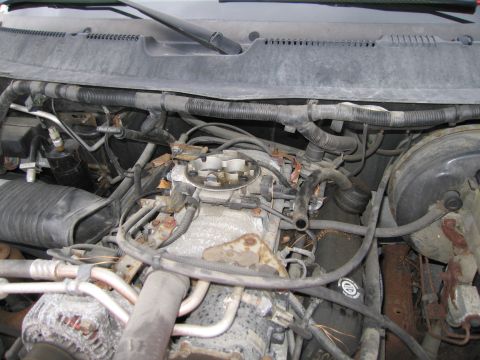 1991 Ford LTD Crown Victoria - Close-up view of a vehicle's engine bay, showing various components and some signs of wear.
