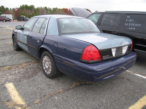 1991 Ford LTD Crown Victoria - This Ford Crown Victoria has a two-tone paint job and appears to be from the early 2000s.