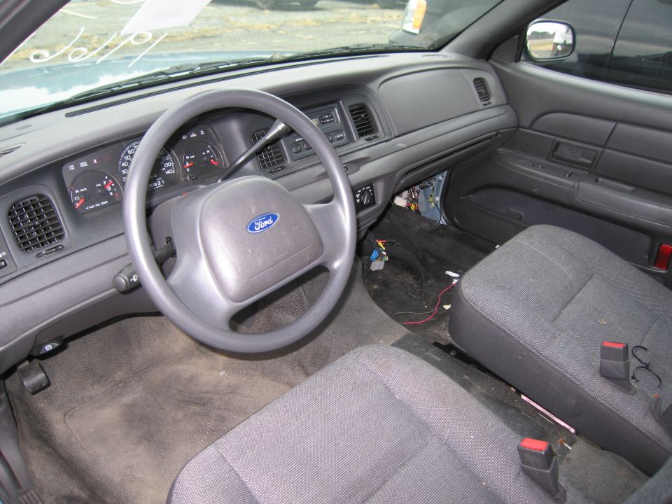 1991 Ford Crown Victoria LTD interior showing dashboard, steering wheel with Ford logo, and front seats
