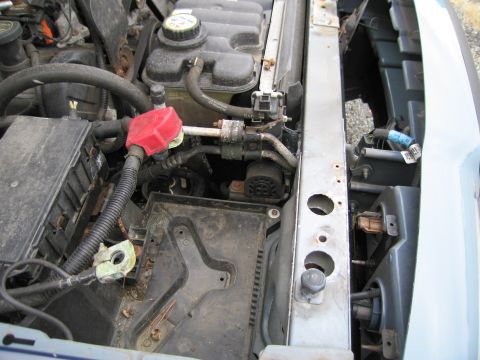 1991 Ford LTD Crown Victoria - Close-up view of a car's engine compartment, showing various components and wiring.