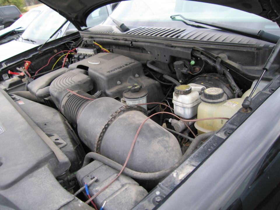 Engine bay with Triton 5.4 V8 engine cover and air intake
