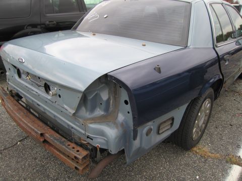 1991 Ford LTD Crown Victoria - This Ford Crown Victoria is missing its rear bumper and has unfinished body panels.