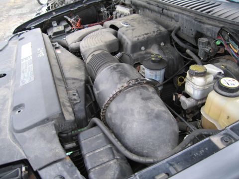 1991 Ford LTD Crown Victoria - Close-up view of a vehicle's engine bay, showing various components and wiring.