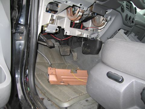 1991 Ford LTD Crown Victoria - The interior of a vehicle is shown with the dashboard disassembled, revealing wiring and components.