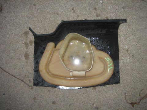 1996 Ford Thunderbird - A fuel pump assembly, possibly for a vehicle, is shown resting on a concrete surface.