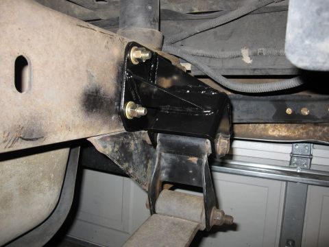 1996 Ford Bronco - Aftermarket shackle flip kit installed on leaf spring suspension.
