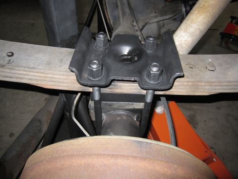 1996 Ford Bronco - Close-up of a vehicle's rear suspension leaf spring and U-bolt assembly.