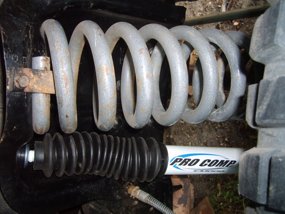 Close-up of a Pro Comp shock absorber and suspension coil