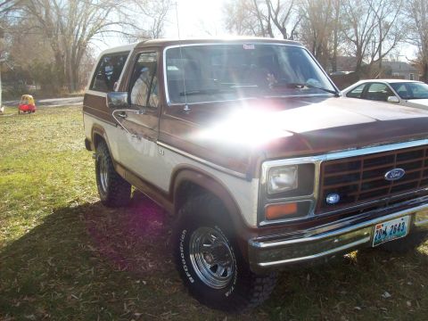 1985 Ford Bronco - This Ford Bronco features a two-tone paint scheme and chrome wheels.