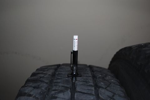 2000 Land Rover Range Rover - A tire tread depth gauge is shown measuring the tread on a tire.