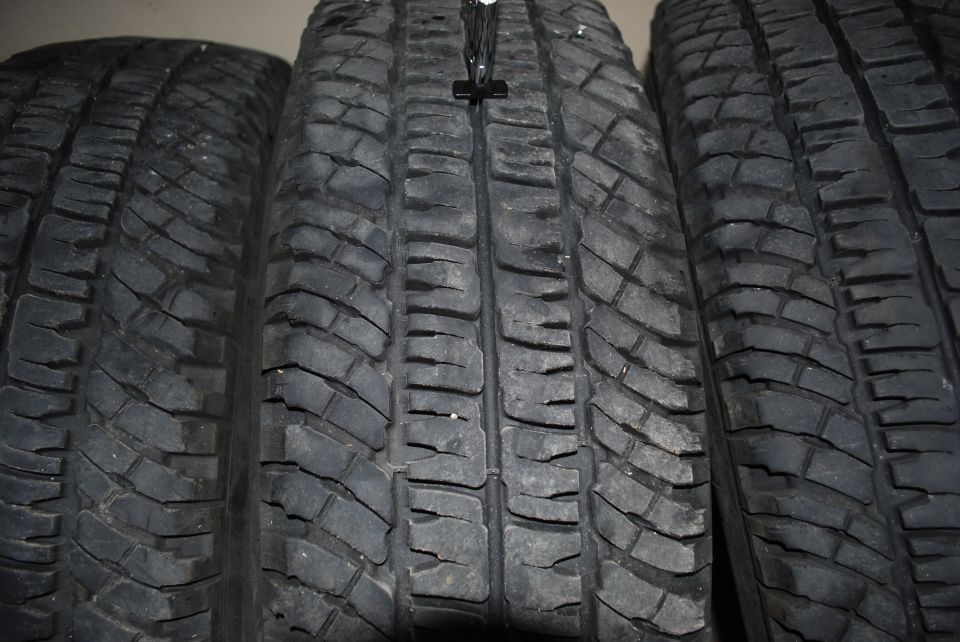 Close-up of three tire treads standing side by side
