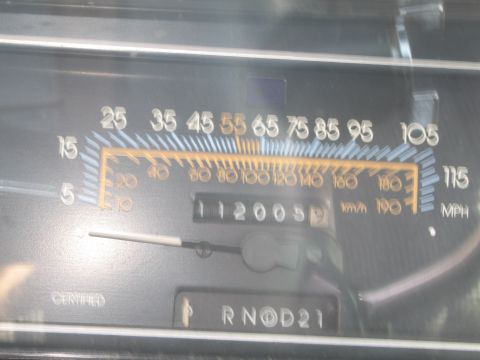 1991 Ford LTD Crown Victoria - Odometer shows 112,005 miles on this car's dashboard. Gear selector is in the 'R' position.