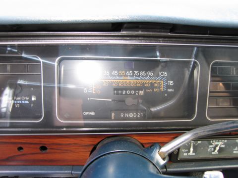 1991 Ford LTD Crown Victoria - Interior view of a vehicle's dashboard, a speedometer and fuel gauge with visible mileage.
