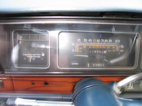 1991 Ford LTD Crown Victoria - Dashboard gauges including fuel and odometer with 11200 miles visible.