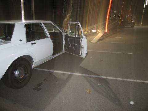 1991 Ford LTD Crown Victoria - White sedan with doors open, parked at night. Appears to be a 1991 model.