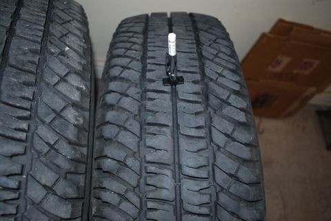 2000 Land Rover Range Rover - A tire tread depth gauge is used to measure the wear on a tire. The registry claims this is a 2000 Land Rover Range Rover, but the image on…