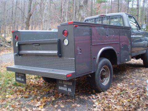 1979 Ford Bronco - Utility truck bed with custom toolboxes and mud flaps from J.C. Madigan Inc.