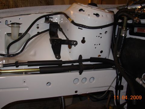 1991 Ford Taurus - Close-up view of engine bay components, including hoses and wiring, with a date stamp of 11.04.2009.
