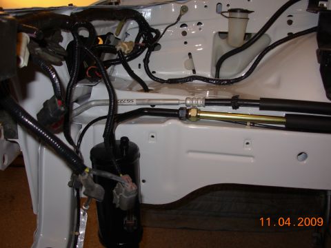 1991 Ford Taurus - Close-up view of engine bay components, including wiring and fluid lines, with a date stamp of 11.04.2009.
