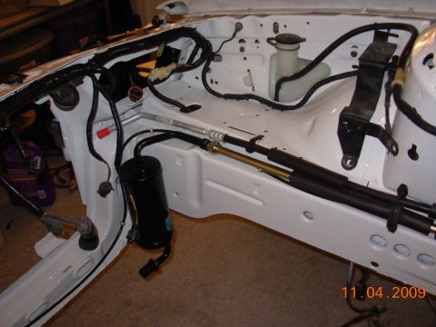 1991 Ford Taurus - The engine bay of a vehicle is shown with various components and wiring, dated November 4, 2009.