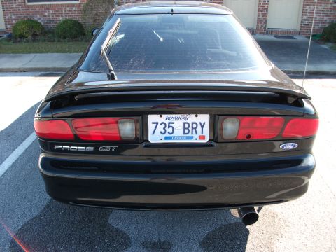1994 Ford Probe - Rear view of a black 1994 Ford Probe GT, showing its distinctive taillights and spoiler.