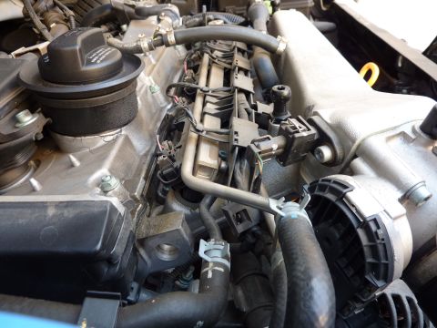2003 Volkswagen Beetle - Engine bay components including fuel injectors and hoses are shown in this close-up view.