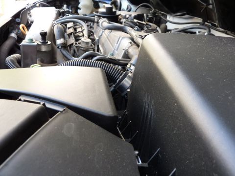2003 Volkswagen Beetle - Close-up view of a vehicle's engine compartment, showing intricate mechanical parts and wiring.