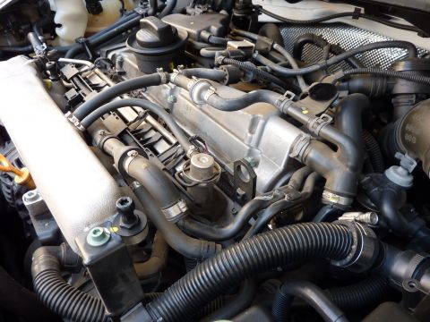 2003 Volkswagen Beetle - Close-up view of a vehicle's engine bay, showing various mechanical parts and tubing.