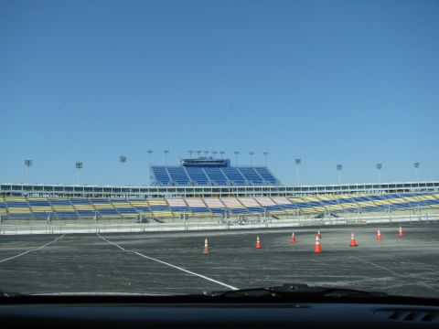 2003 Mercury Marauder - View of the Kentucky Speedway grandstands and track, with several orange cones placed on the asphalt.