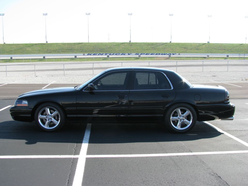 Side view of a black 2003 Mercury Marauder parked in a lot