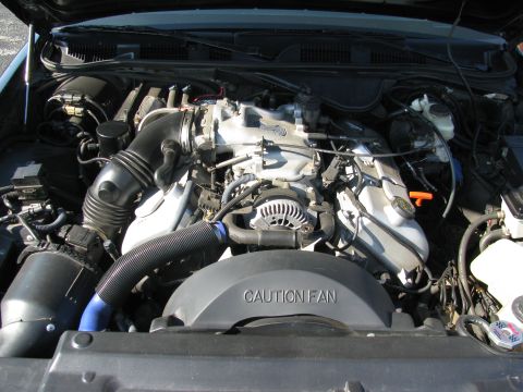 2003 Mercury Marauder - Engine bay view showing V8 engine components and cooling fan shroud.