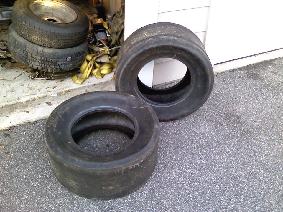 two racing tires, one stacked on top of another