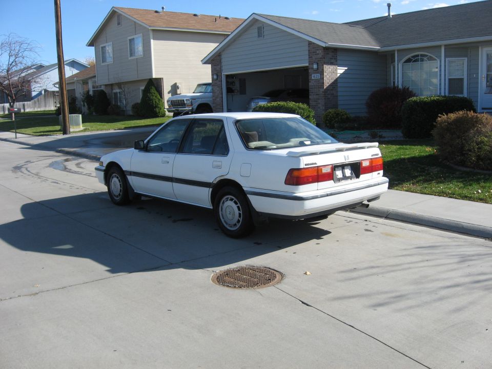 1989 Honda Accord sedan parked on a suburban street, rear view