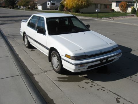 1989 Honda Accord - White 1989 Honda Accord sedan parked on a residential street.
