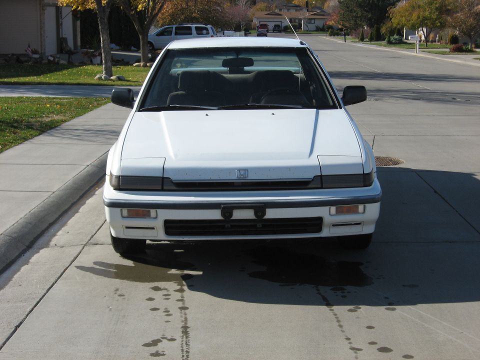 Front view of a white 1989 Honda Accord parked on a driveway