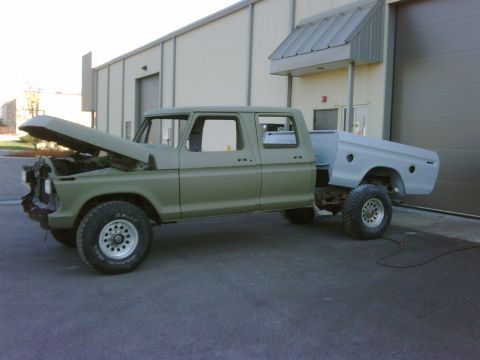 1979 Ford F-250 - This truck appears to be undergoing restoration or modification, with its hood up and a separate bed section.
