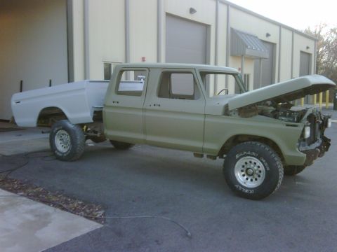 1979 Ford F-250 - This 1979 Ford F-250 crew cab pickup truck is shown from the front-three-quarter angle with its hood up.