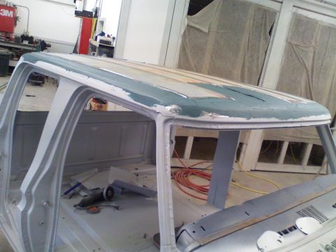 1979 Ford F-250 - The cab roof of a 1979 Ford F-250 is shown with primer and filler applied, indicating bodywork in progress.